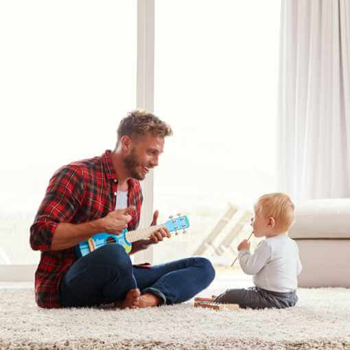 Man and baby on carpet